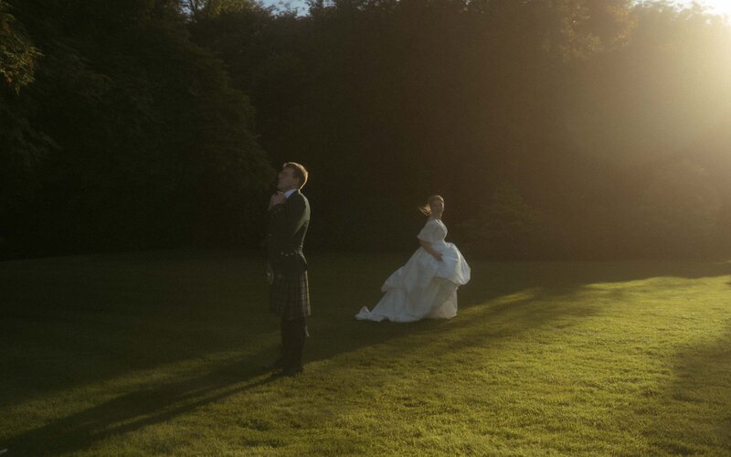 Romantic sunset photoshoot with a married couple, capturing love and intimacy against the warm, golden hues of the setting sun for a magical, timeless moment
