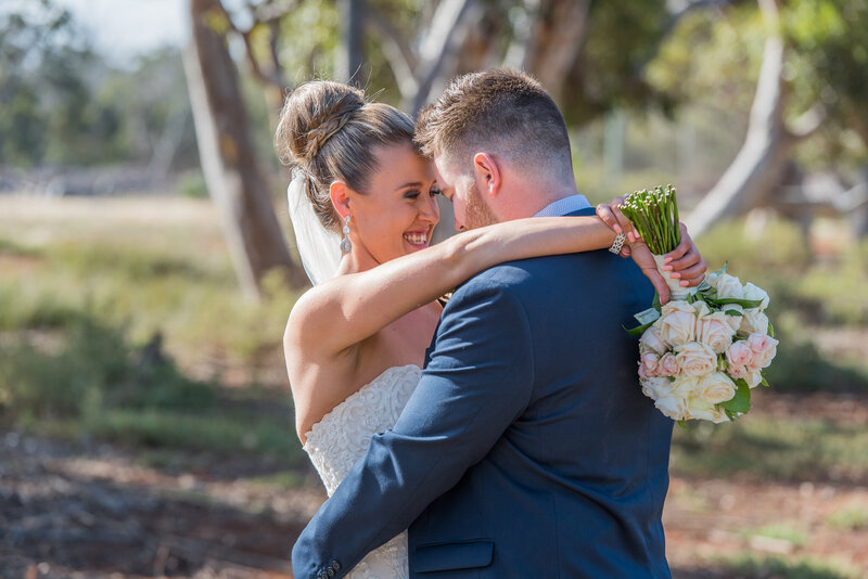 Newlyweds Allison and Ash sharing a special moment during their photo session after the wedding at Eynesbury Homestead
