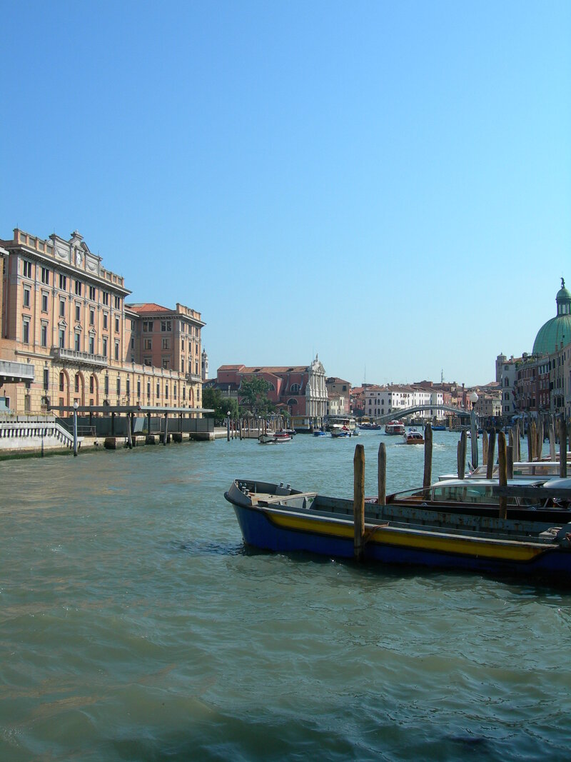 Grand Canal in Venice with boats on a clear day with blue skies