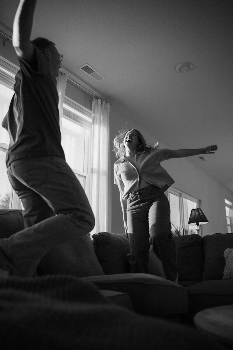 Married couple jumps on the couch