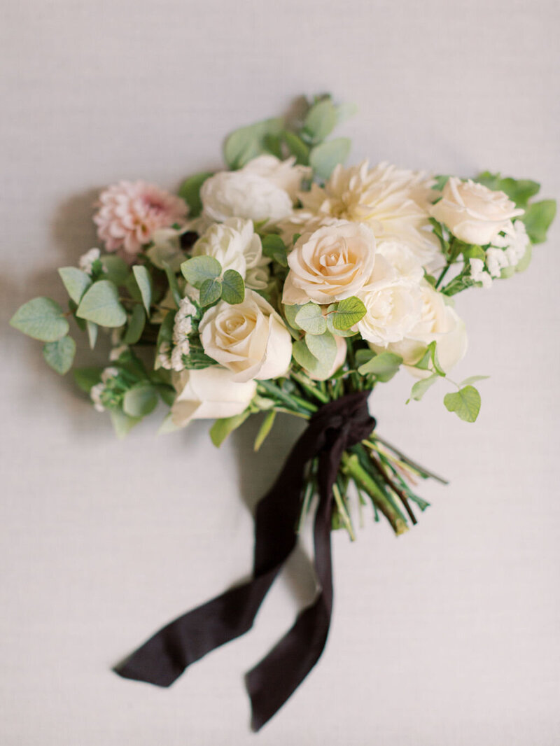 White, tan and blush bridal bouquet with black ribbon
