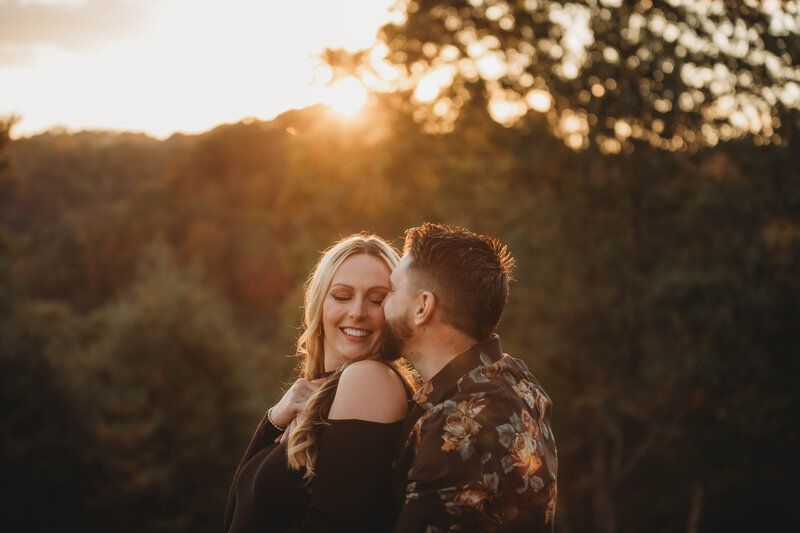 a couple embracing at sunset in Athens, West Virginia