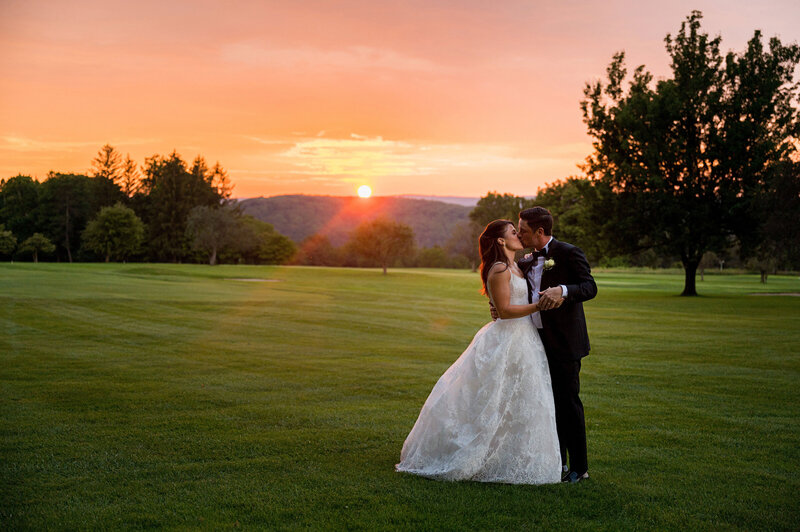 married couple in laurel highlands golf course at sunset romantic
