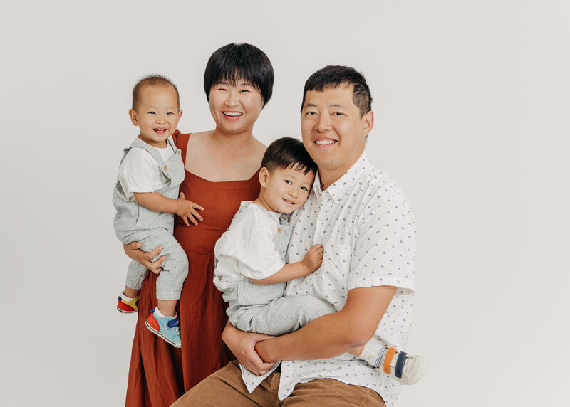 Family with toddlers photographed in Marie Buck Photography's Burbank studio.