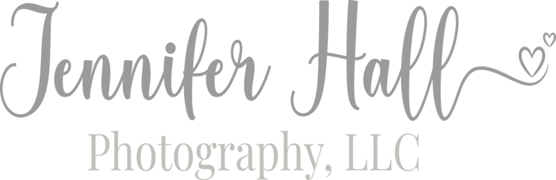 “Jennifer Hall” logo words with a heart character for a North East, PA, photographer.