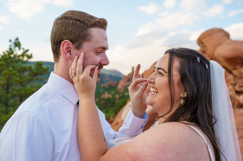 Romantic couples portrait overlooking Dillon Reservoir at Sapphire Point, captured by a Colorado micro-wedding photographer with an adventurous and scenic style