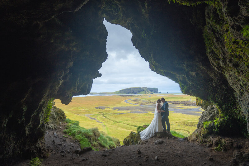 Iceland elopement with stunning partially ash-covered glacier in the background.