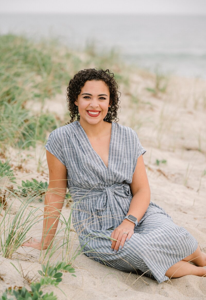 Christine Hazel Photography, a Cape Cod wedding photographer, sitting on the beach 