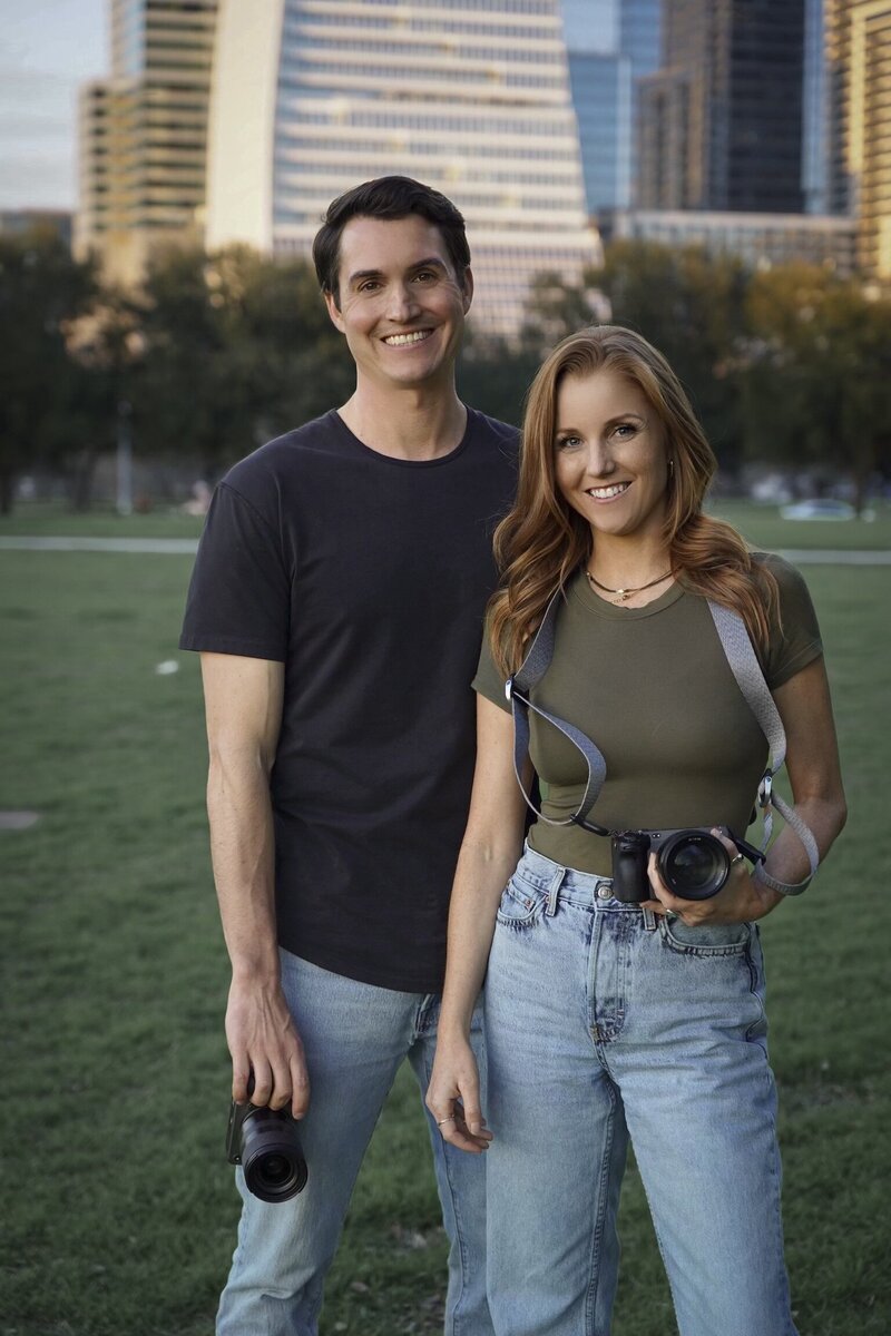 couple holding cameras