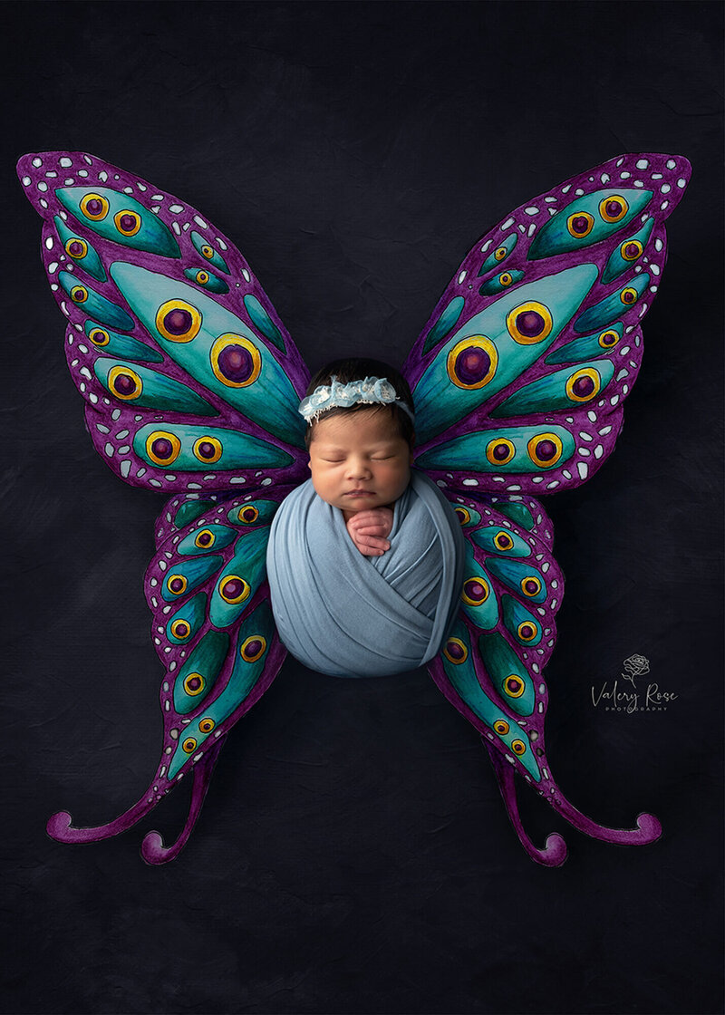 composite image of newborn with butterfly wings