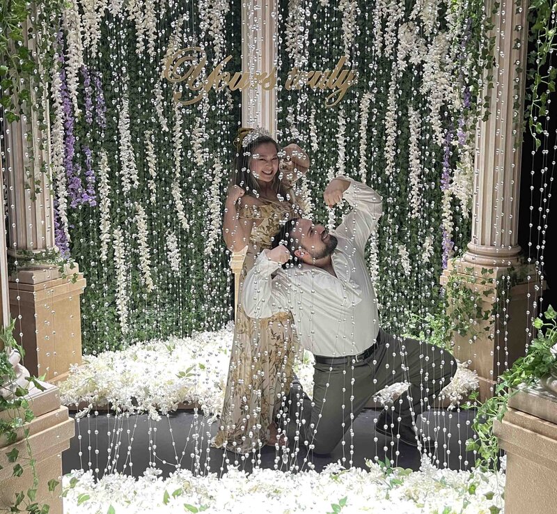 DC Calligrapher having fun with her spouse at an elaborately decorated venue for the Bridgerton experience in DC