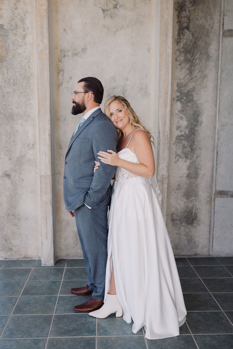 Brida and groom smiling for wedding portraits after ceremony in Florida