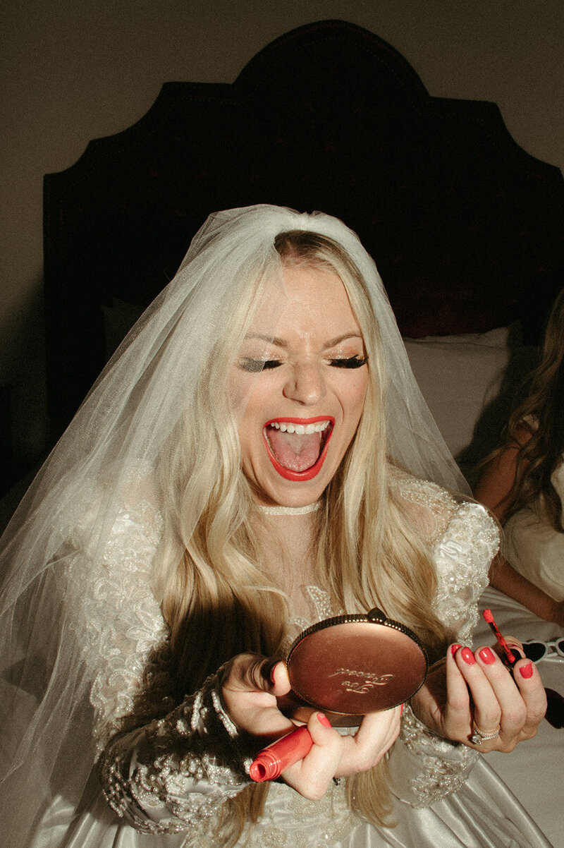 Bride getting ready with wedding coordinator