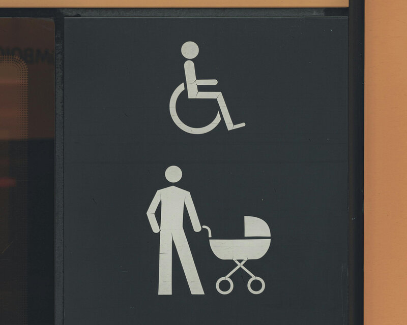 ADA compliant black and white signage reflecting accessibility and inclusiveness for design
