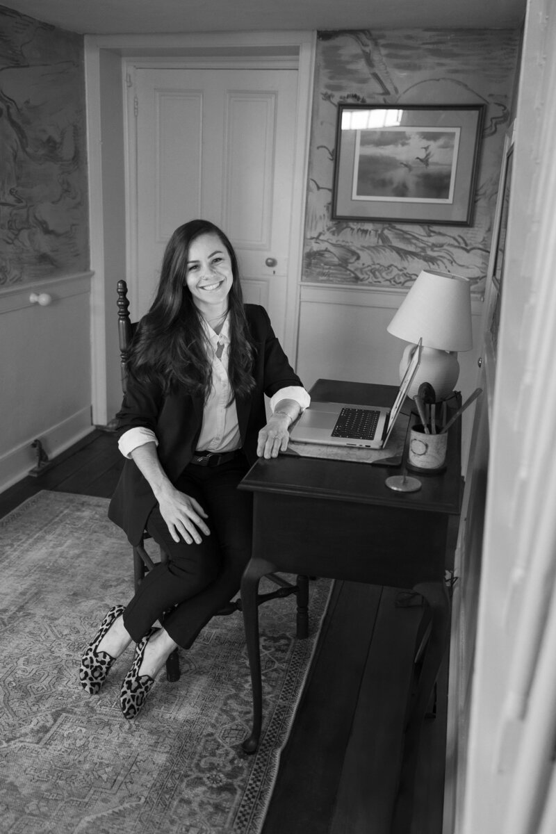 Portrait of a Charlottesville wedding photographer with camera, specializing in romantic and elegant wedding photography throughout Virginia and the Shenandoah Valley