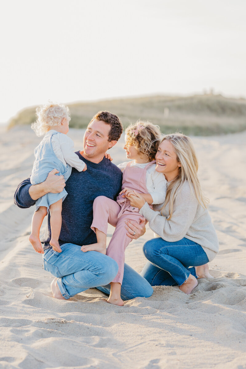 A family photographed on a Nantucket beach by Rebecca Love