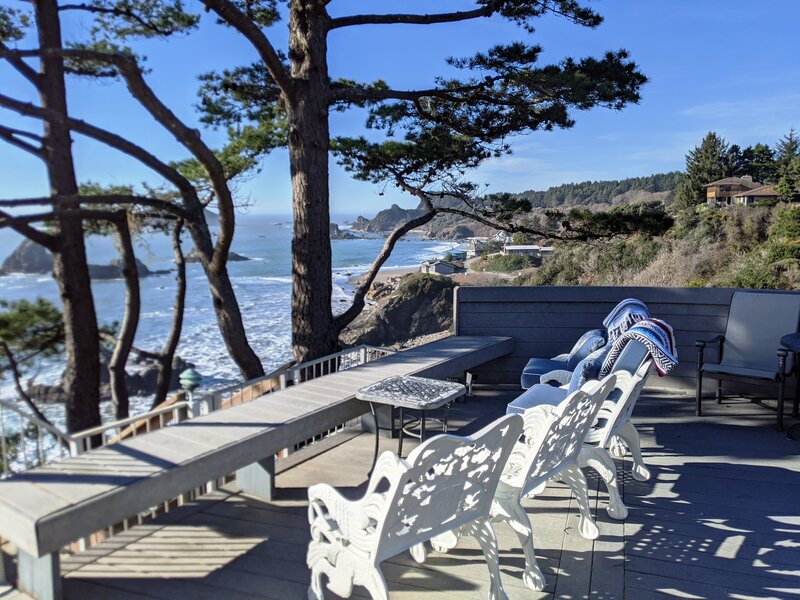 Chairs around a chess table overlooking the ocean