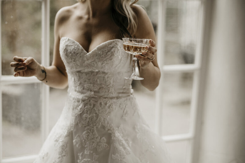 Bride toasting with fancy champagne  glass on her wedding day