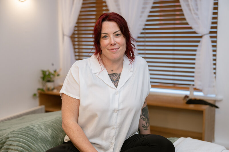 Ellen from the Guiding Raven Wellness, a registered massage therapist in Banff, Alberta—inviting new and returning clients to connect, book services, or ask questions