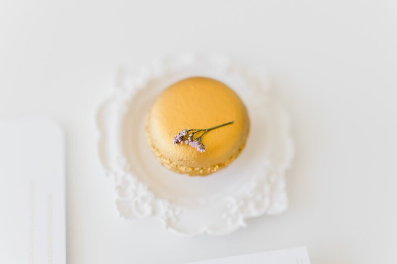 Bespoke gold macaron designed by ECLAT Destination Weddings