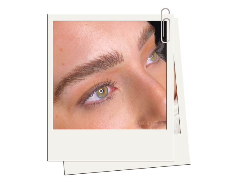 Female enhanced eyebrows that look naturally fluffy, through nicroblading services at ARCHED Coastal in Gulf Shores, Alabama.