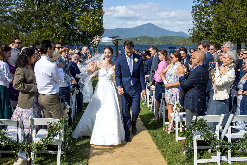 Married couple walking down the aisle