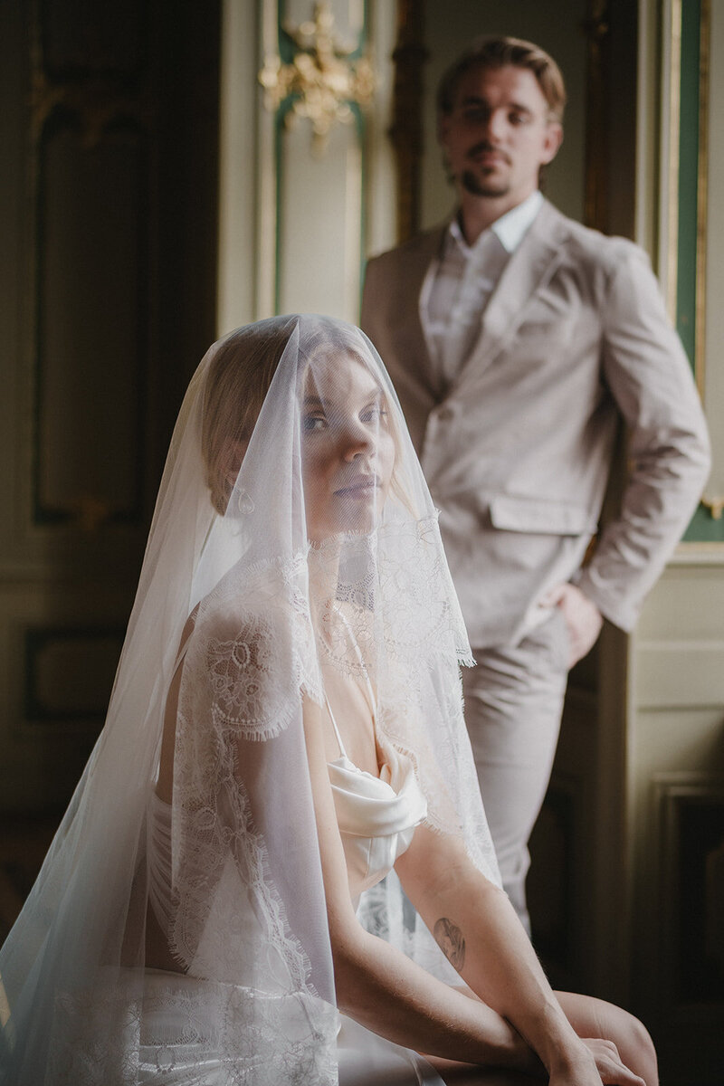 Bride and groom sharing a quiet moment in a baroque Berlin venue