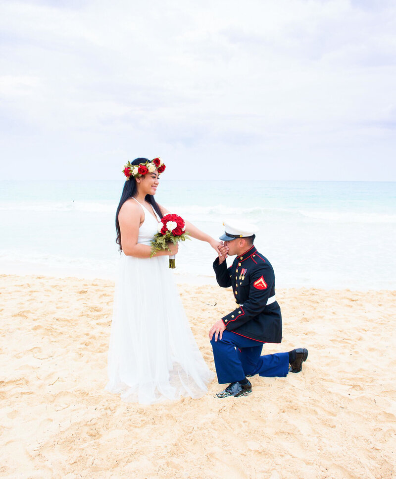 Hilton Hawaiian Village Wedding Photography, uniformed groom kneeling in front of bride