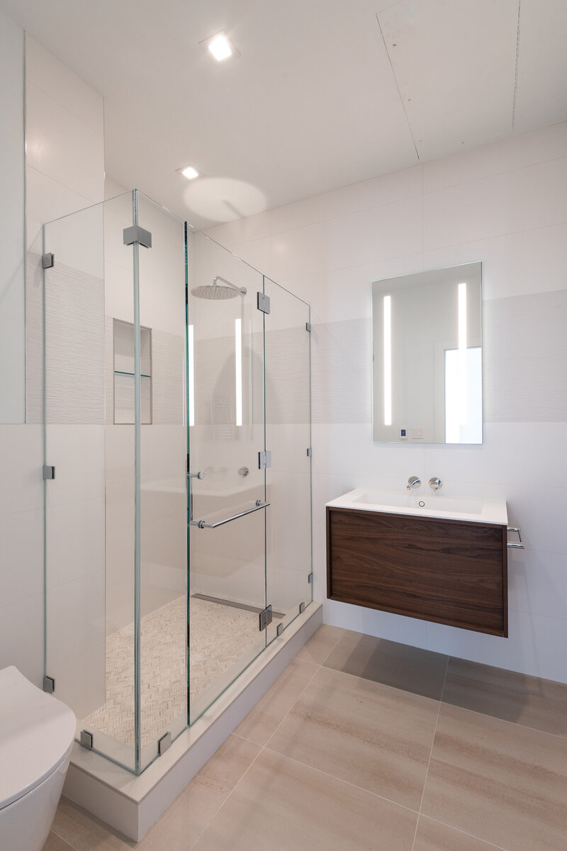 Guest bathroom with custom vanity and Italian fixtures