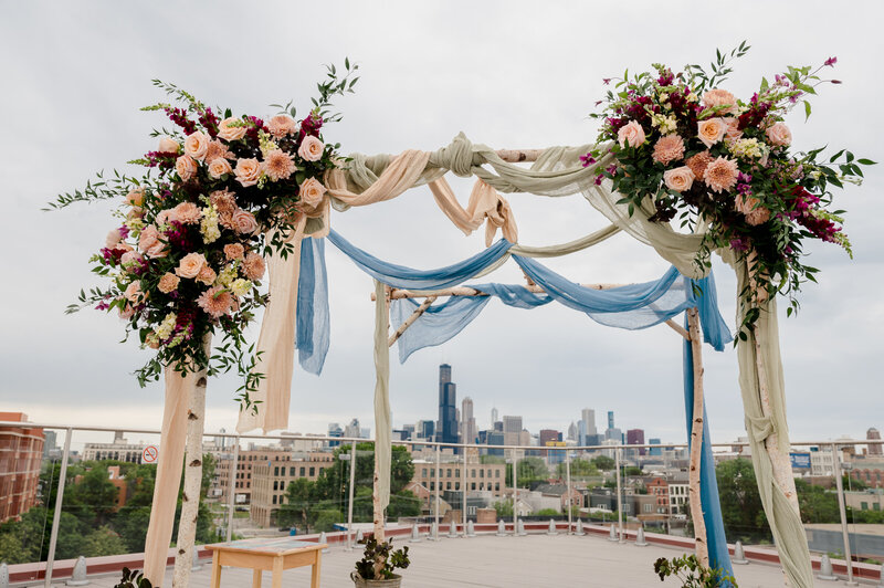 Pink flowers at rooftop wedding ceremony at  Lacuna Loft in Chicago, IL