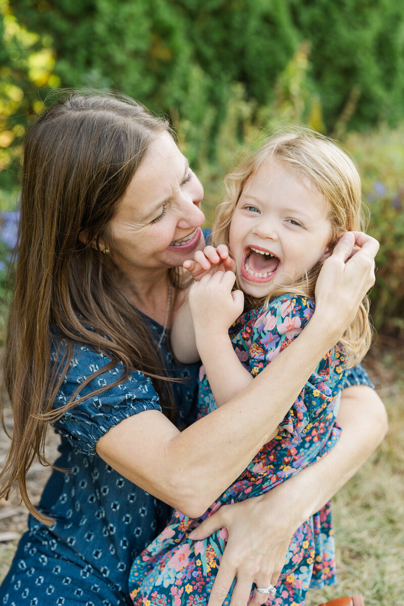 mother and daughter laughing