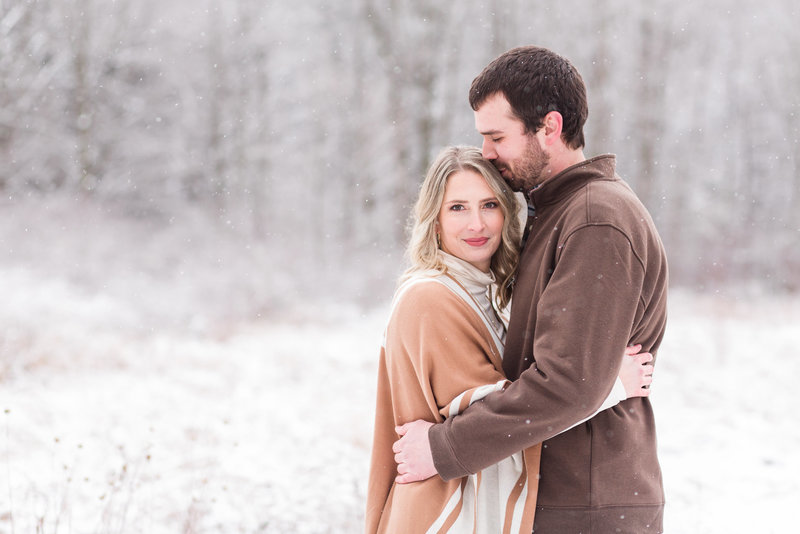 snowy engagement photos at quail hollow state park in hartville ohio photographed by Jamie Lynette Photography  Canton Ohio Wedding and Senior Photographer