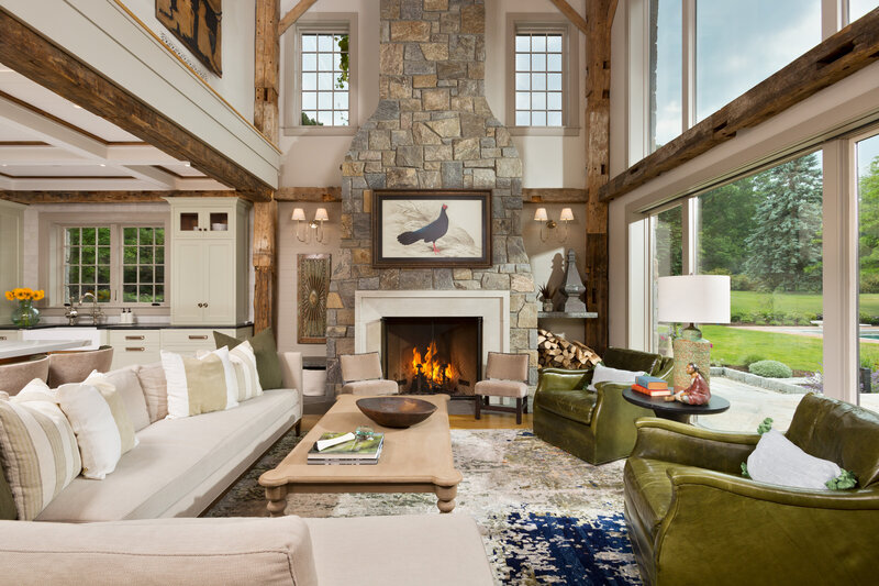 Large living room with brick fireplace and large open windows