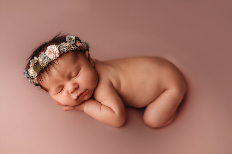 Infant posed for Newborn Portraits during  Baby Photoshoot in Asheville.