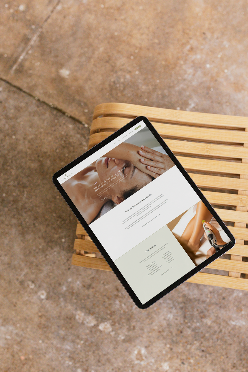 Website Design example by web designer Coja Creative displayed on ipad placed on a chair.