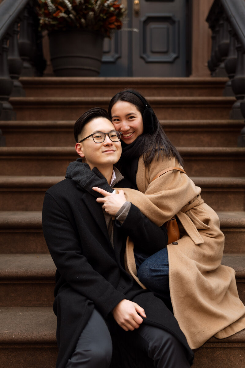 Couple embracing on NYC stoop