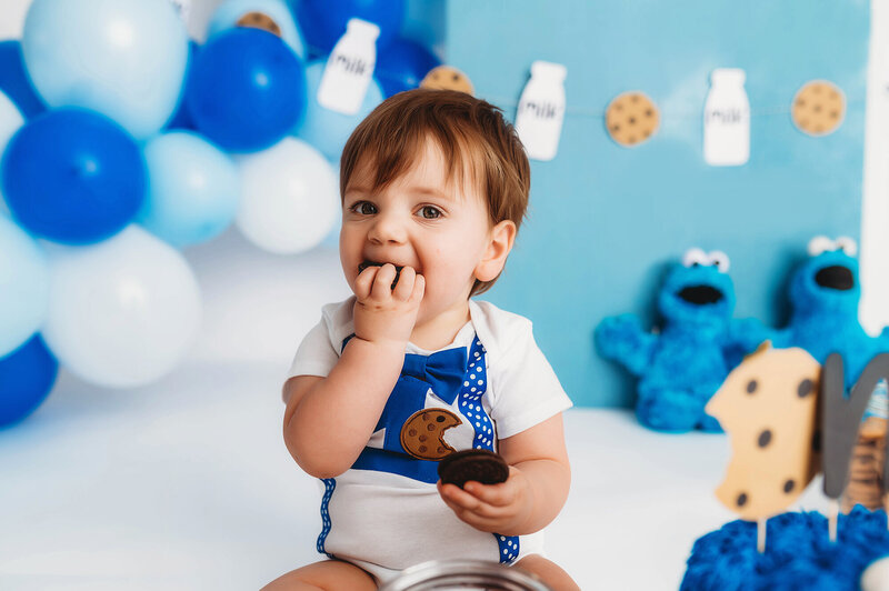 Baby enjoys cake during Cake Smash Photoshoot in Asheville, NC.