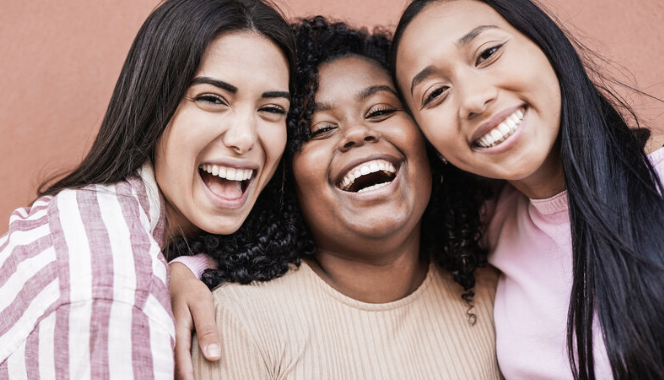 Three girls smiling 