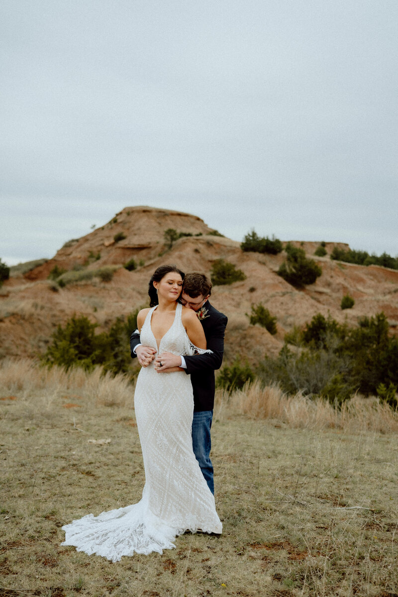 bride and groom hugging and laughing together during their texas elopement