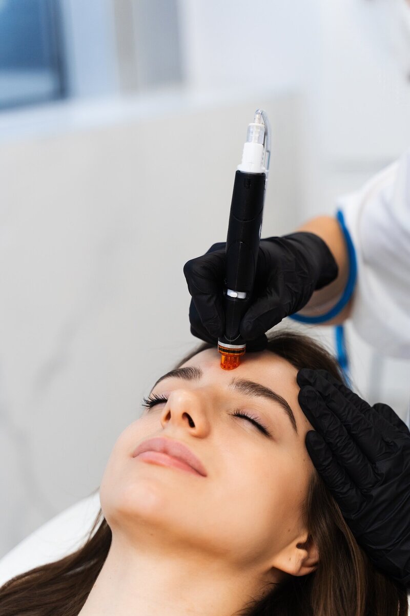 young woman receiving a hydrafacial