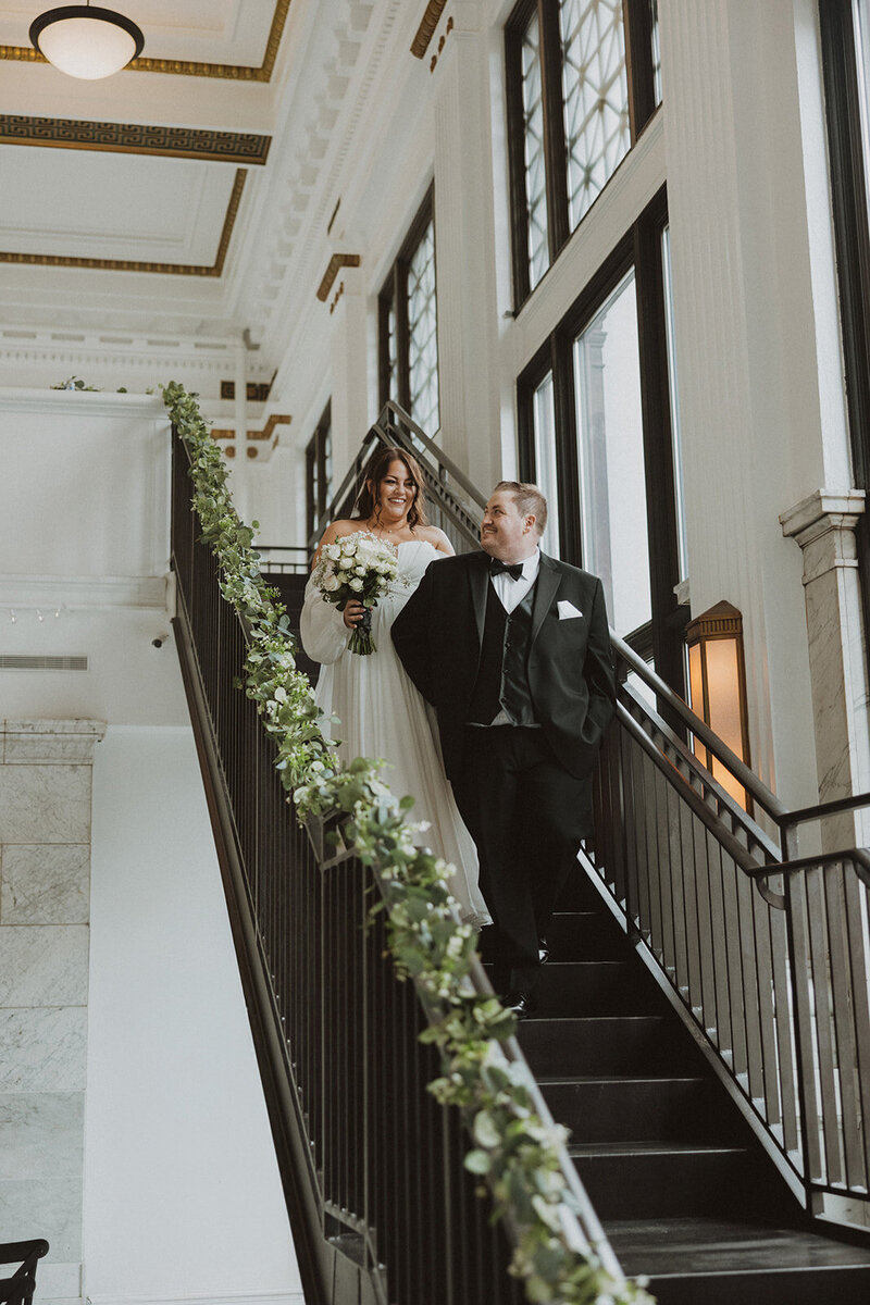 Bride and Groom walk down stairs at Citizens Ballroom in Washington DC wedding venue