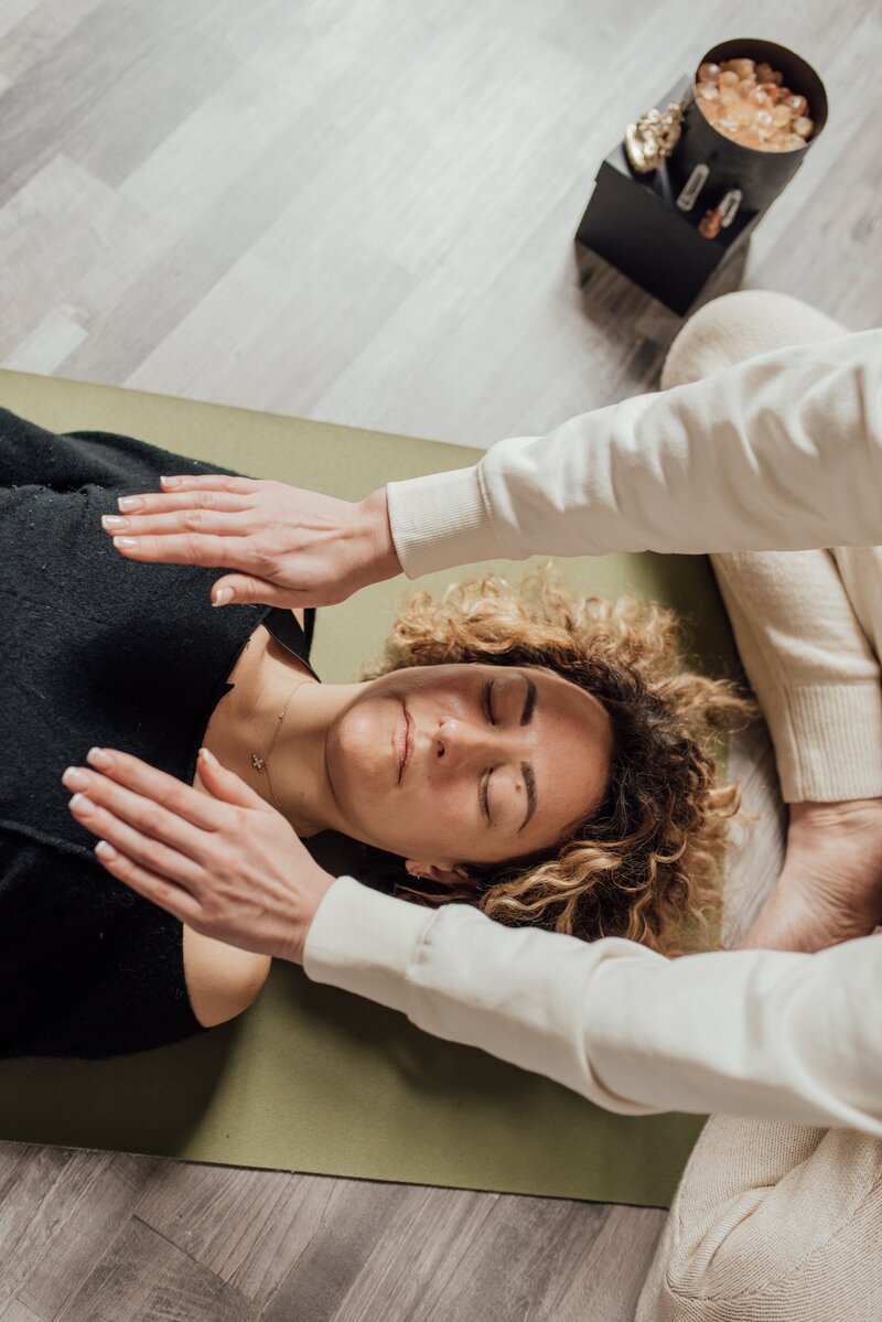 Woman lying down on sofa in calm room