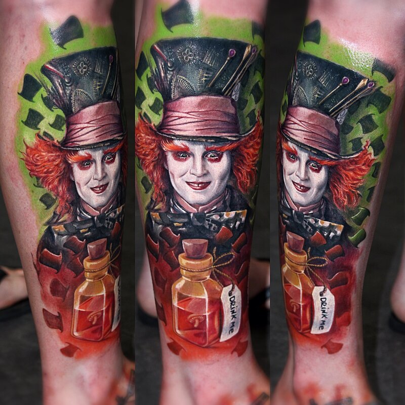 A detailed Mad Hatter tattoo featuring vibrant colors and intricate shading, inspired by Alice in Wonderland.
