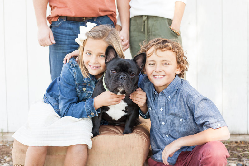 family poses for portrait with french bulldog in  clovis california