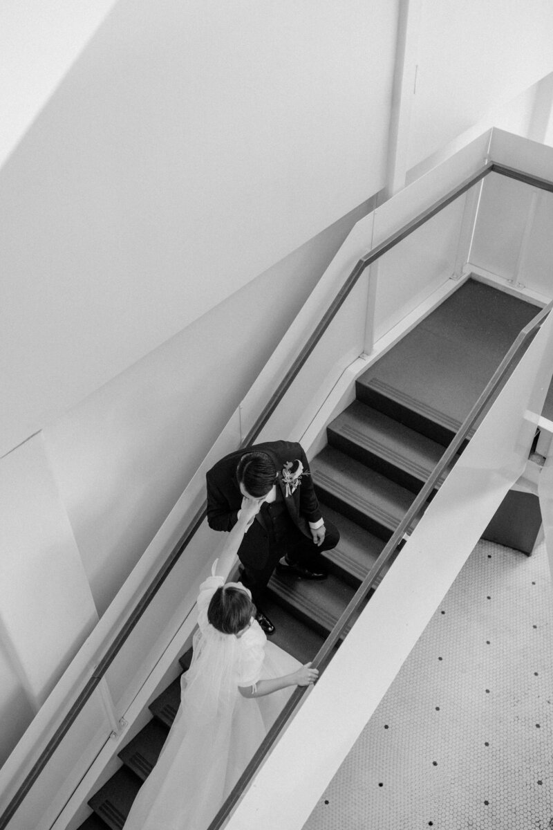 Bride gracefully stepping down stairs