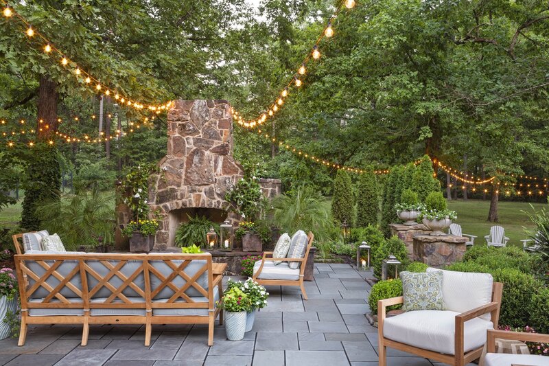 backyard-fireplace-patio-lanterns-string-lights-garden-retreat