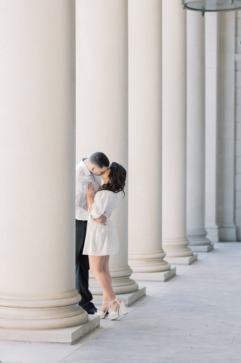 Columbia SC Wedding Photographer | Couple  kissing in between columns