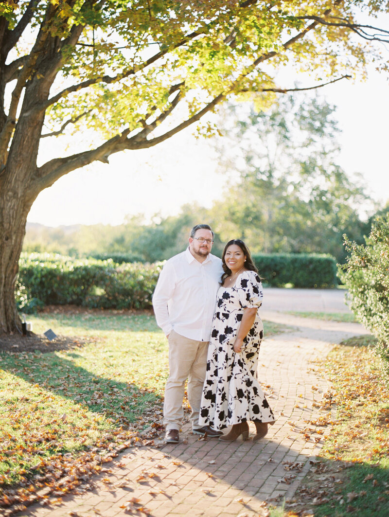 Film image of husband and wife in the fall at a park in Virginia