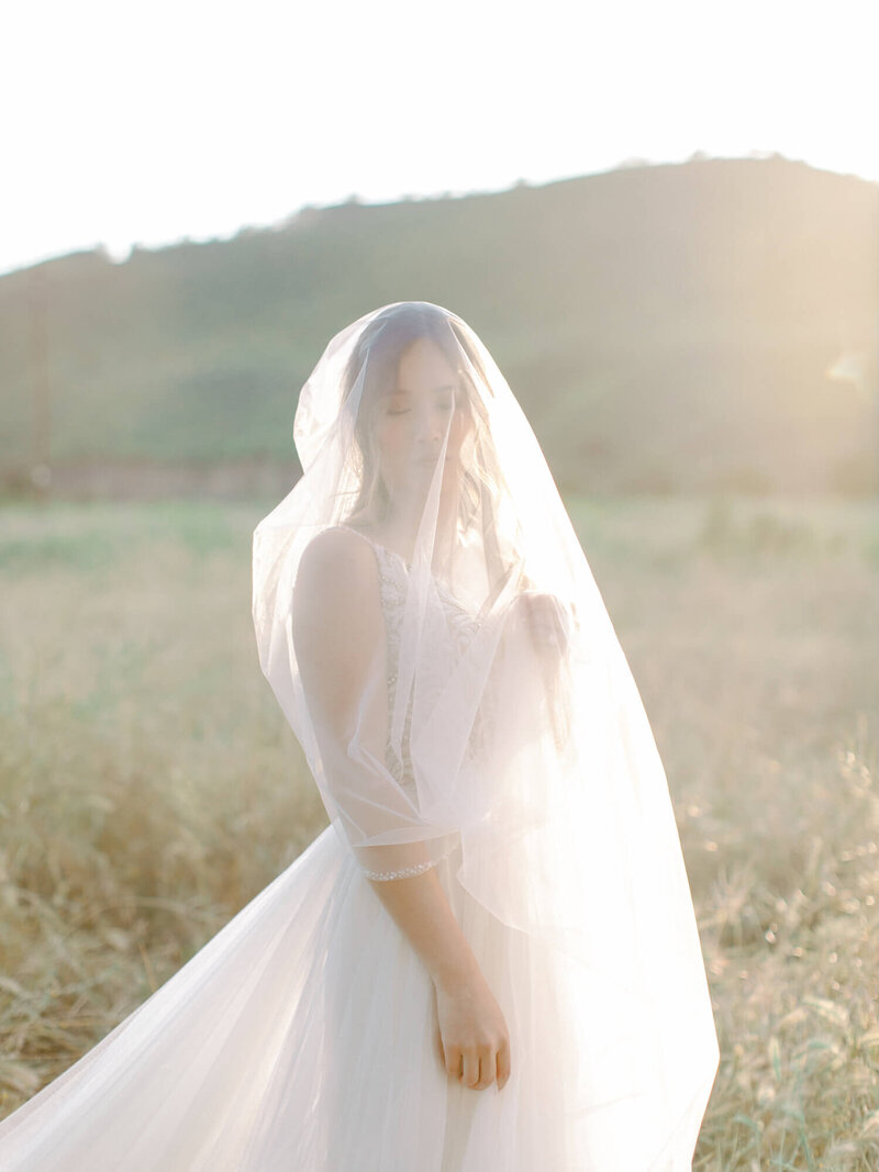 editorial wedding photography of bride with veil over her face