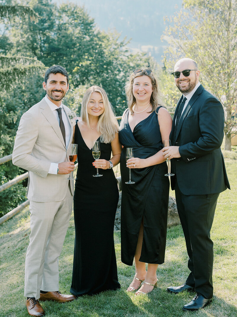 wedding-guests-drinking-champagne-in-the-garden
